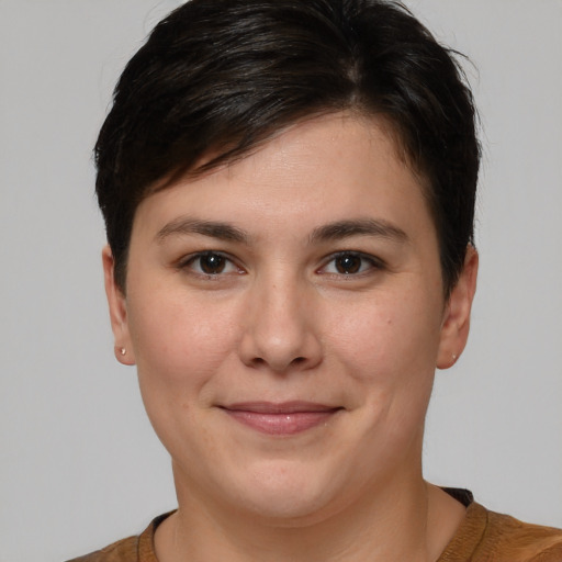 Joyful white young-adult female with short  brown hair and brown eyes