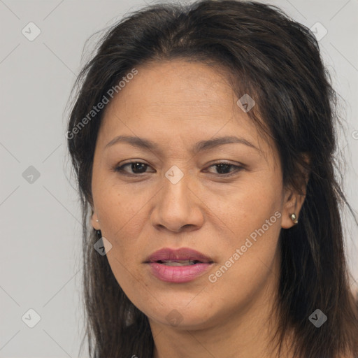 Joyful asian adult female with long  brown hair and brown eyes