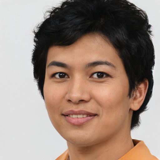 Joyful asian young-adult female with short  black hair and brown eyes