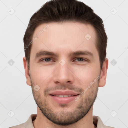 Joyful white young-adult male with short  brown hair and brown eyes