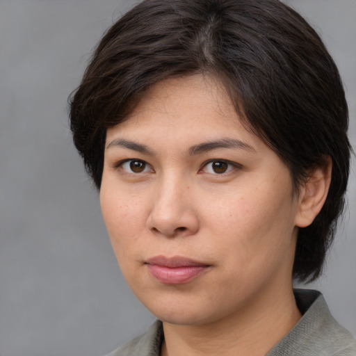 Neutral white young-adult female with medium  brown hair and brown eyes