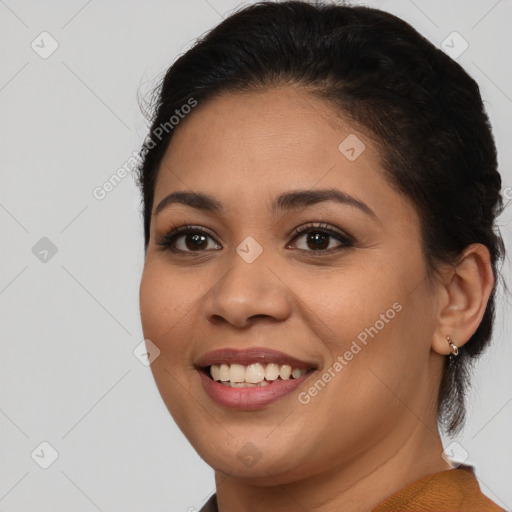 Joyful latino young-adult female with medium  brown hair and brown eyes