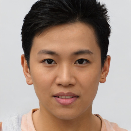 Joyful asian young-adult male with short  brown hair and brown eyes