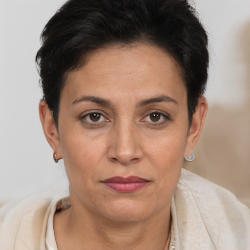 Joyful white adult female with short  brown hair and brown eyes