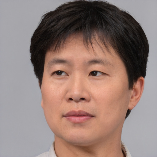 Neutral asian young-adult male with short  brown hair and brown eyes
