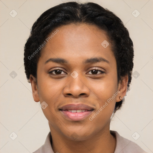 Joyful black young-adult female with short  black hair and brown eyes