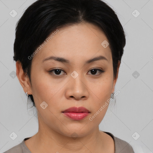 Joyful asian young-adult female with medium  black hair and brown eyes