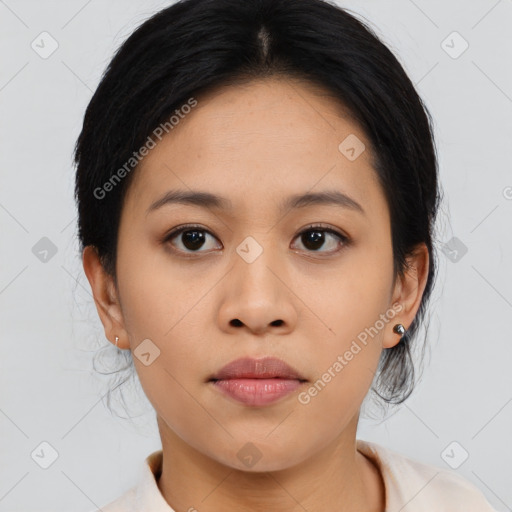 Joyful asian young-adult female with medium  black hair and brown eyes