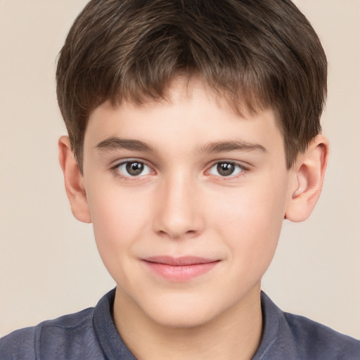 Joyful white child male with short  brown hair and brown eyes