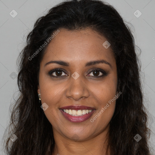 Joyful black young-adult female with long  brown hair and brown eyes