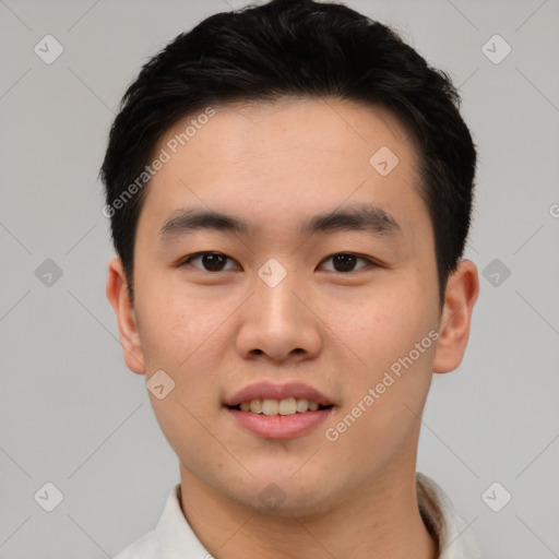 Joyful asian young-adult male with short  black hair and brown eyes