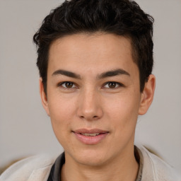 Joyful latino young-adult male with short  brown hair and brown eyes