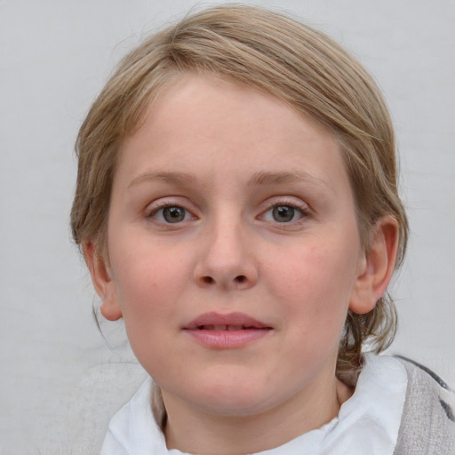 Joyful white child female with medium  brown hair and blue eyes