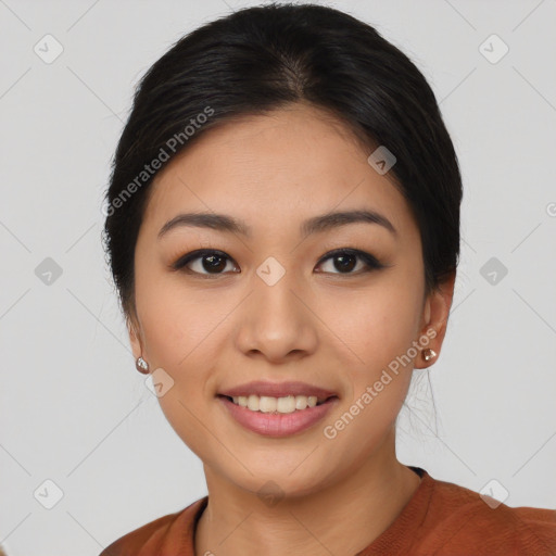 Joyful asian young-adult female with short  black hair and brown eyes