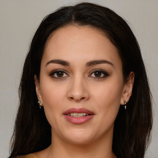 Joyful white young-adult female with long  brown hair and brown eyes