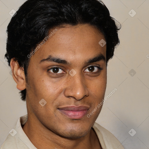 Joyful latino young-adult male with short  brown hair and brown eyes