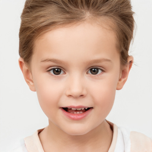 Joyful white child female with short  brown hair and brown eyes