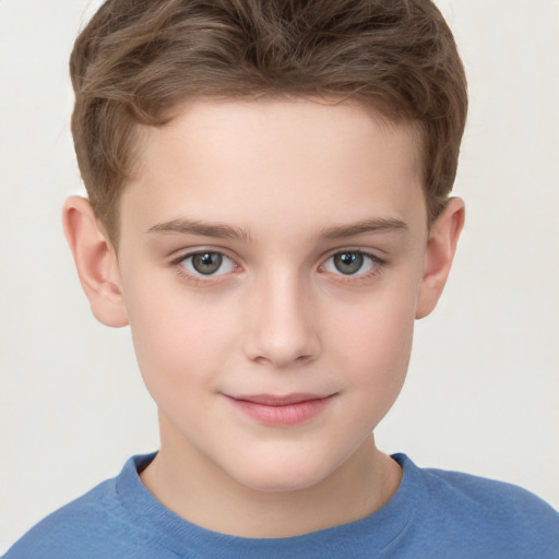 Joyful white child male with short  brown hair and grey eyes