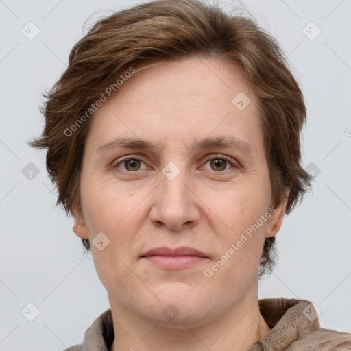 Joyful white adult female with short  brown hair and grey eyes