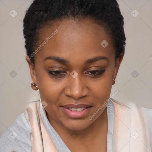 Joyful black young-adult female with short  black hair and brown eyes