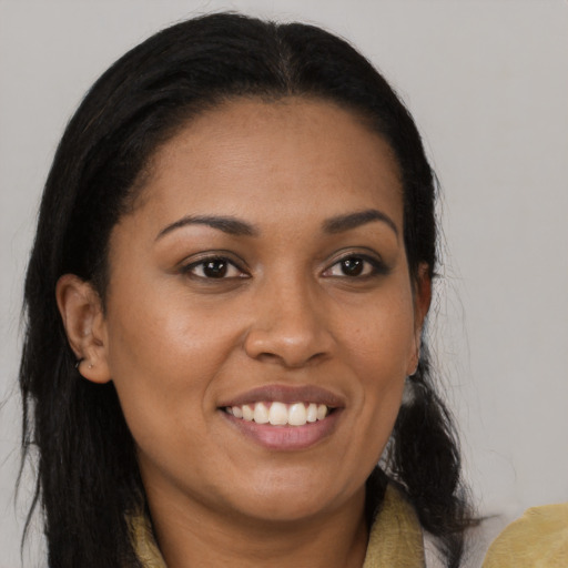 Joyful latino young-adult female with medium  brown hair and brown eyes