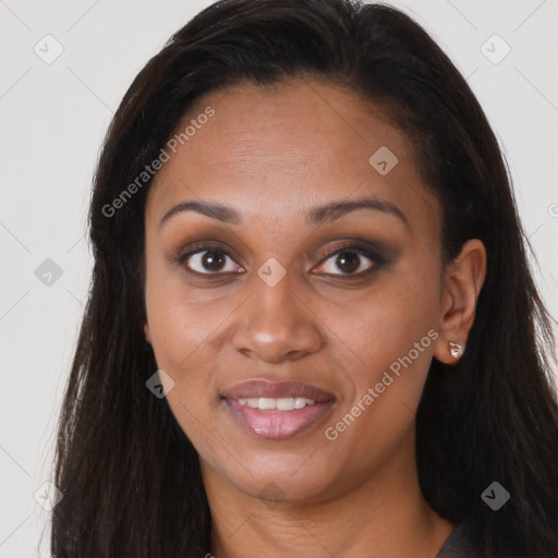 Joyful black young-adult female with long  brown hair and brown eyes