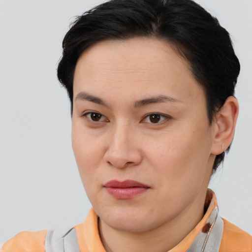 Joyful asian young-adult female with short  brown hair and brown eyes