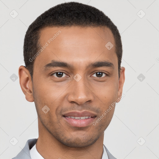 Joyful black young-adult male with short  brown hair and brown eyes