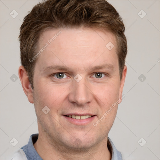 Joyful white adult male with short  brown hair and grey eyes