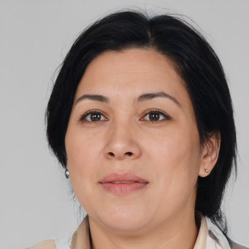 Joyful asian adult female with medium  brown hair and brown eyes