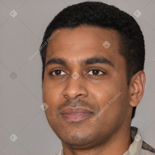 Joyful latino young-adult male with short  black hair and brown eyes