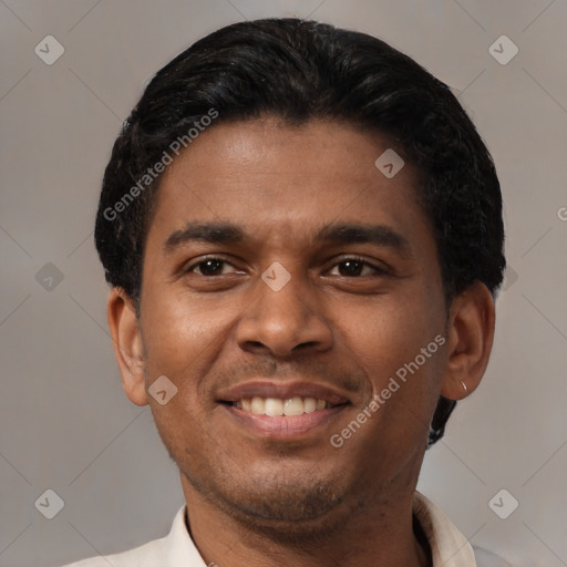 Joyful latino young-adult male with short  black hair and brown eyes