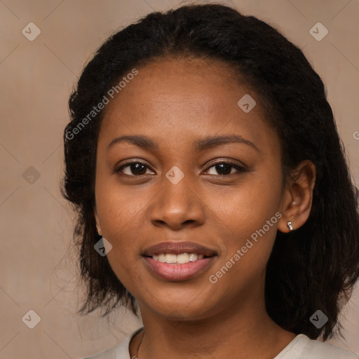 Joyful black young-adult female with medium  brown hair and brown eyes