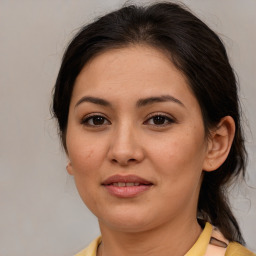 Joyful latino young-adult female with medium  brown hair and brown eyes