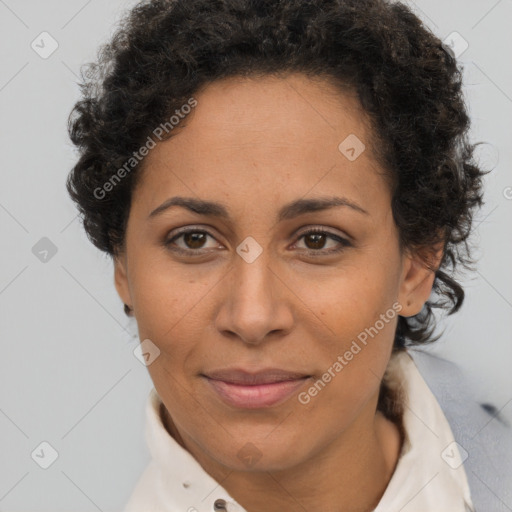 Joyful black adult female with short  brown hair and brown eyes