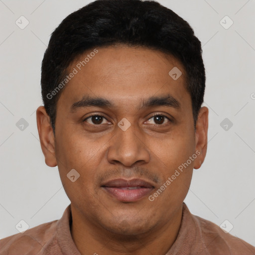 Joyful latino young-adult male with short  black hair and brown eyes