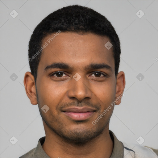 Joyful black young-adult male with short  black hair and brown eyes