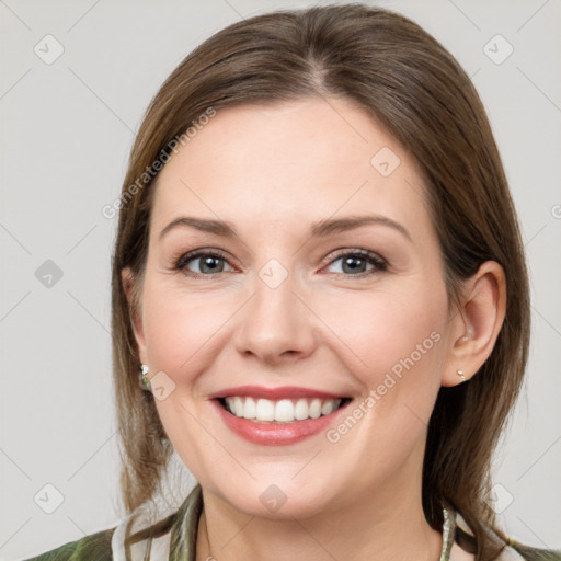 Joyful white young-adult female with medium  brown hair and grey eyes