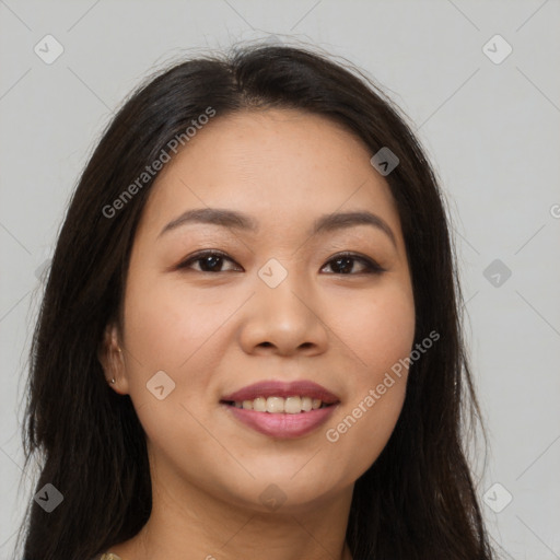 Joyful asian young-adult female with long  brown hair and brown eyes