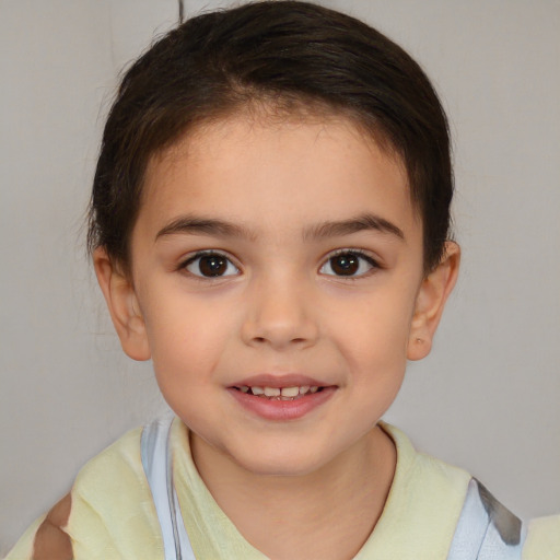 Joyful white child female with short  brown hair and brown eyes