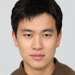 Neutral asian young-adult male with short  brown hair and brown eyes