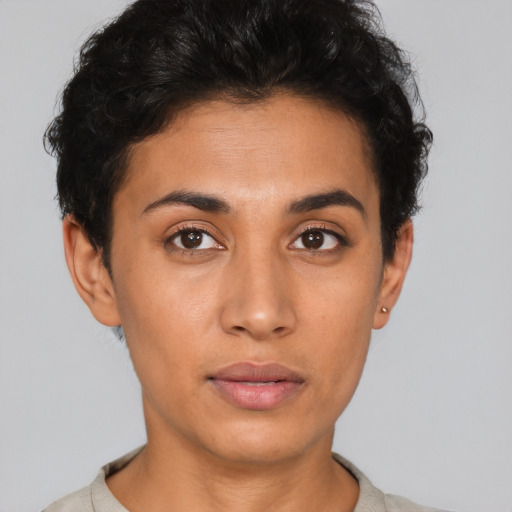 Neutral latino young-adult female with short  brown hair and brown eyes