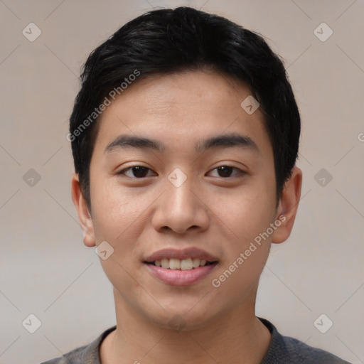 Joyful asian young-adult male with short  black hair and brown eyes