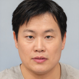 Neutral asian young-adult male with short  brown hair and brown eyes