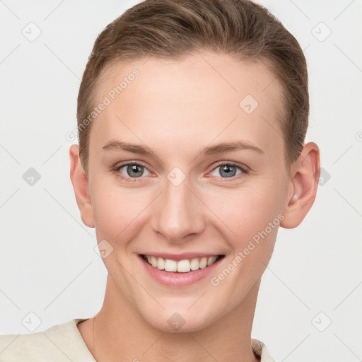 Joyful white young-adult female with short  brown hair and grey eyes