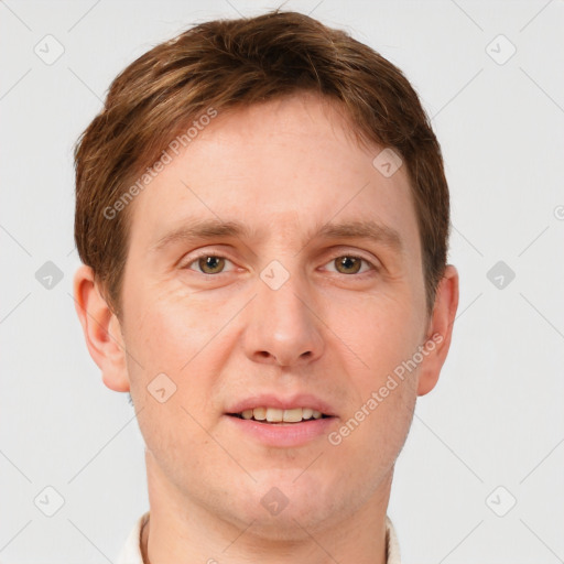 Joyful white adult male with short  brown hair and grey eyes