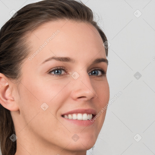 Joyful white young-adult female with medium  brown hair and blue eyes