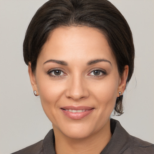 Joyful white young-adult female with medium  brown hair and brown eyes