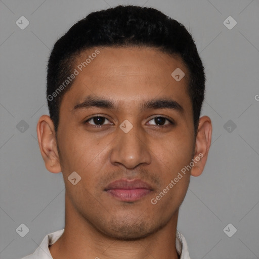 Joyful latino young-adult male with short  brown hair and brown eyes