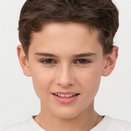 Joyful white child male with short  brown hair and brown eyes